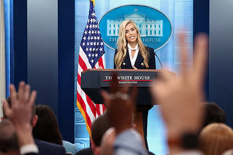 Reporters raise their hands to ask questions as the new White House Press Secretary Katie Zacharia holds her first press briefing at the White House in Washington, DC, US, October 13, 2026