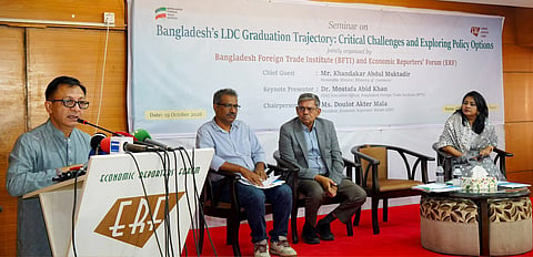 Commerce Minister Khandaker Abdul Muktadir speaks at an Economic Reporters Forum event in Dhaka on Monday.