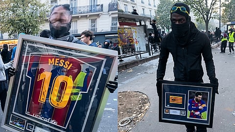 Looters parade the Messi memorabilia.