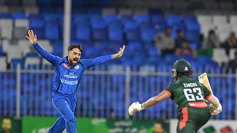 Afghanistan's Rashid Khan celebrates after taking the wicket of Parvez Hossain Emon during their ODI tri-series match in Abu Dhabi on Wednesday.