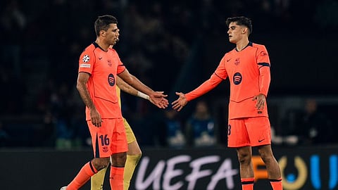 Barcelona's Rodri (L) shakes hands with teammate Gerard Martin after their UEFA Champions League match against PSG in Paris on Wednesday.