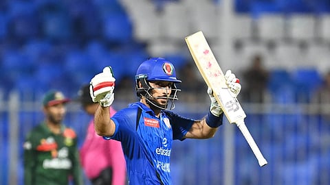 Afghanistan captain Rahmat Shah acknowledges the crowd after completing a half-centuy.