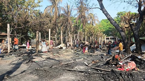 Fire debris lies scattered across Jelepara fishing village in Kutubdia, Cox’s Bazar, after a blaze destroyed 33 homes early Friday.