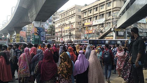 Garment workers block the Mirpur-10 roundabout in Dhaka on Thursday morning, demanding payment of unpaid wages and allowances.