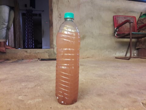 Goa : Drinking water supply collect in bottle for sampling. This water supply from water resoures Palyem Pernem.