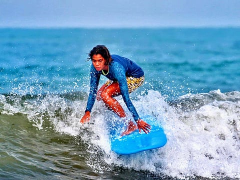 Goa's Surfer Sugar surfing in competition (Goa)