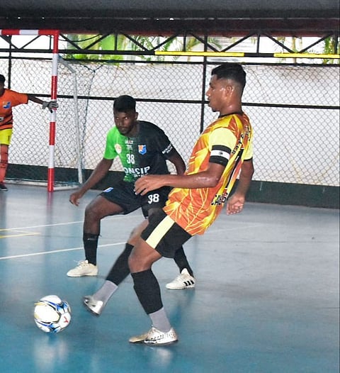 Goa Futsal : Clancio Pinto of Santa Cruz club Cavelossim controls the ball.