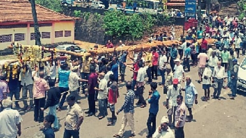 Devotees bringing wooden poles for Jatra