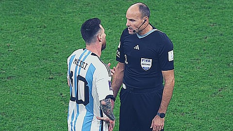 Antonio Mateu Lahoz and Lionel Messi