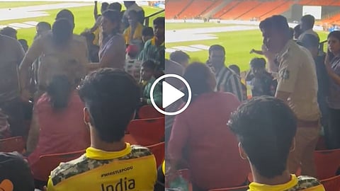 female spectator and police officer fight