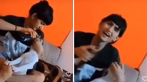 A shocking video of a woman force-feeding her pet puppy beer.