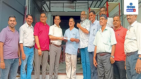 giving the check, MLA Dr. Chandrakant Shetye