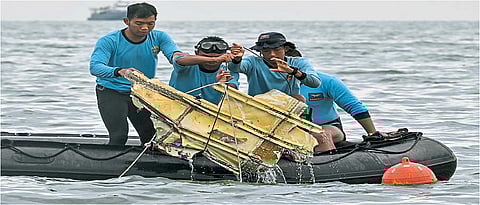 officials found part of the wreckage of Indonesian Jetliner Crashes Into the Sea After Takeoff Carrying 62 fliers some clothes from the passengers had been found in waters