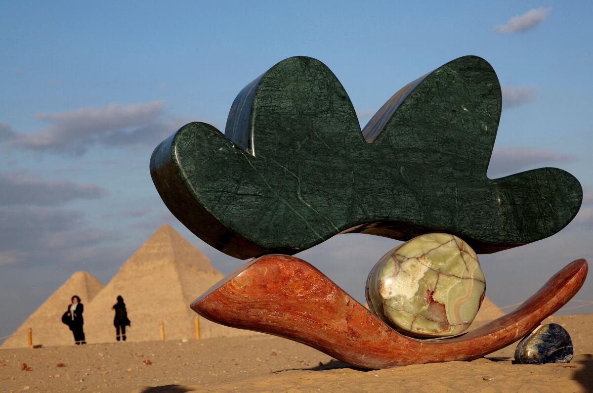 The project 'Echoes Of The Infinite' by Alex Proba and Solidnature is displayed during a contemporary art exhibition in its fifth edition, organized by Art D'Egypte, in front of the Great Pyramids of Giza, on the outskirts of Cairo, Egypt.