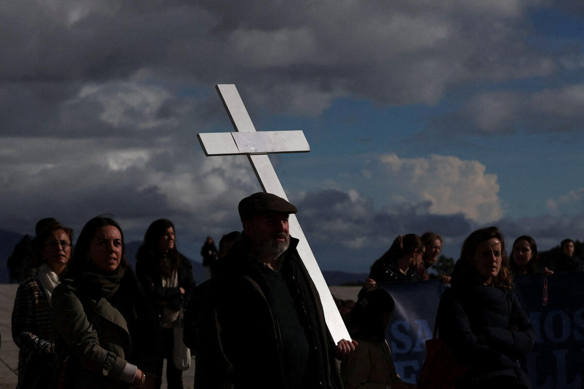 People gather to pray the Rosary against changes to the Valley of the Fallen, now known as the Valley of Cuelgamuros, which once held the remains of former dictator Francisco Franco and contains the graves of more than 30,000 people from both sides of the Spanish Civil War, days before the 50th anniversary of Franco's death on November 20, in San Lorenzo de El Escorial, Spain.