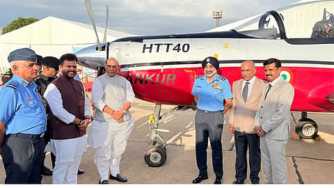 Alt="Rajnath Singh with Ram Mohan Naidu and Navy officials"