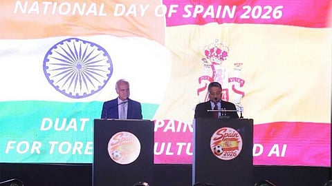 Alt="MEA Secretary Sibi George speaking at Spain's National Day celebrations in New Delhi"