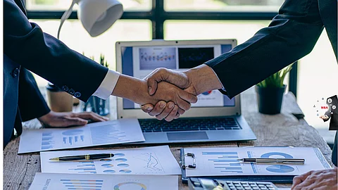 Businessmen shaking hands for an acquisition