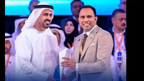 Anas receiving the award