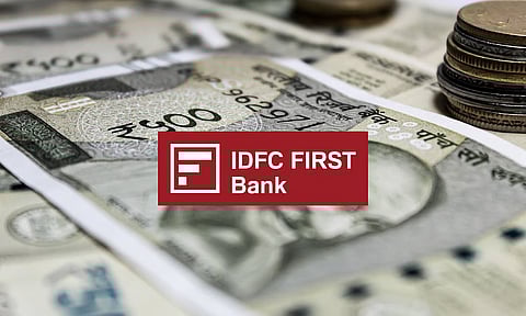 Logo of IDFC First Bank with rupee notes in the background