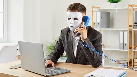 A person with a mask talking on the phone