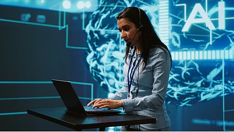 A professional looking lady working on a laptop with AI written in the background