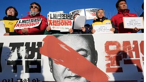 Protesters stage a rally to demand South Korean President Yoon Suk Yeol to step down, in Seoul on Wednesday.