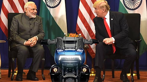 Prime minister Narendra Modi and Us president Donald trump in conversation - Harley Davidosn Pan America tourer bike in the background
