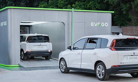 ev swaping station, two cars entering it