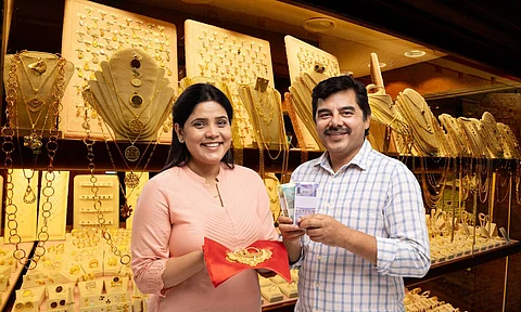 lady and a man with gold in hand