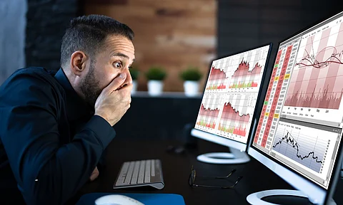 a Man in Shock looking computer screen