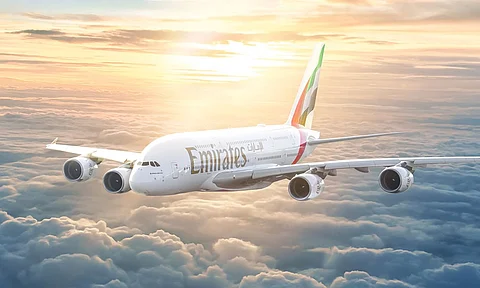 Emirates flight flying over the sky