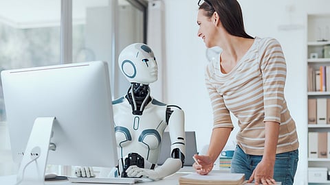 robot and a women is working in a office