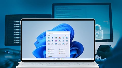 Laptop screen displaying Windows 11 start menu, with a digital security and coding background featuring binary numbers and a padlock icon