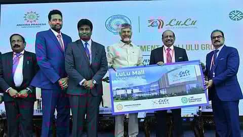 Lulu Group chairman M. A. Yusuff Ali and executive director M. A. Ashraf Ali hand over the design of the upcoming Visakhapatnam Lulu Mall to Andhra Pradesh chief minister N. Chandrababu Naidu, in the presence of industries minister T. G. Bharat and chief secretary Neerabh Kumar Prasad.