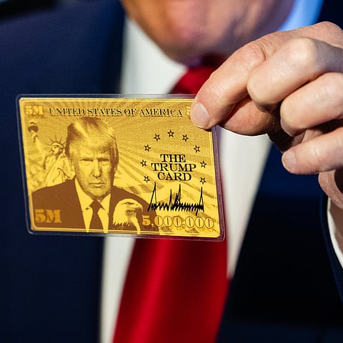 Gold Card in hand