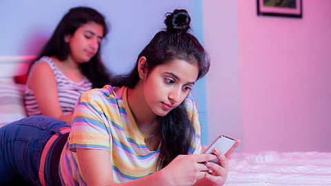 girl looking at mobile phone