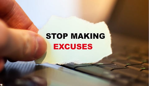 Motivationa text stop making excuses on paper on notebook background