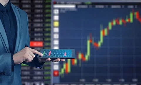 stock market update checking hands