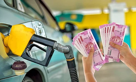 Petrol pump, rupee note