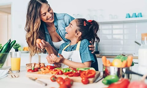 mom and daughter with vegitables