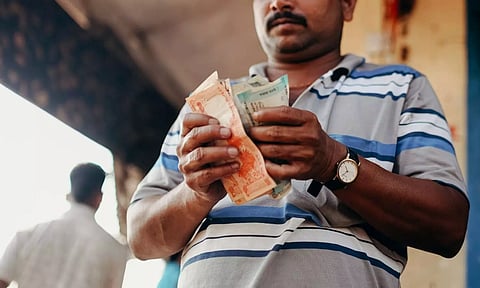 Man counting currency notes