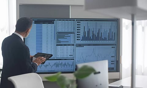 stock market update checking hands