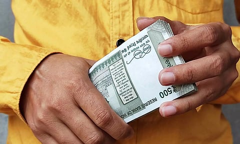 Indian Rupee in hand