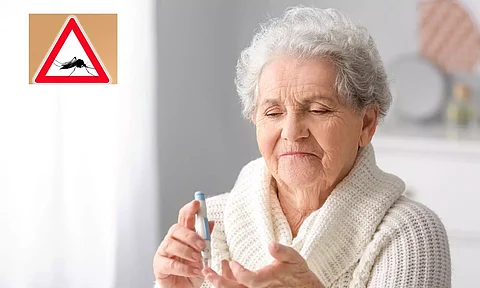 Old woman checking sugar level