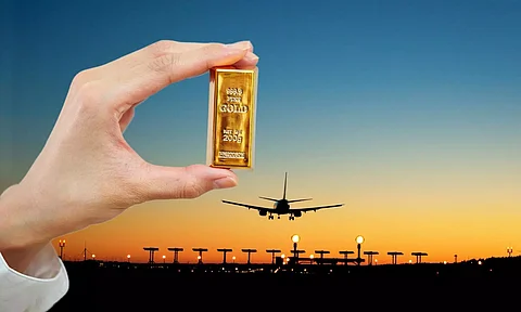 Gold bar in hand