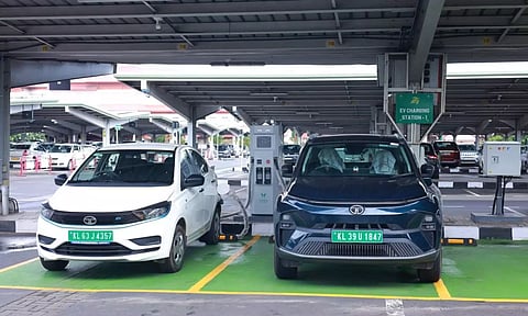 ev charging station two tata electric cars in a parking lot