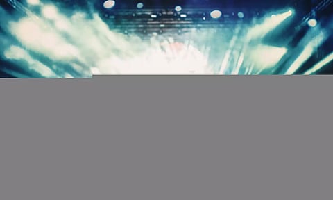 people cheering in a concert