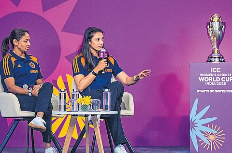 Star batter Smriti Mandhana (right) speaks while skipper Harmanpreet Kaur looks on during the ICC Women’s Cricket World Cup 2025 trophy unveiling ceremony in Mumbai on Monday.