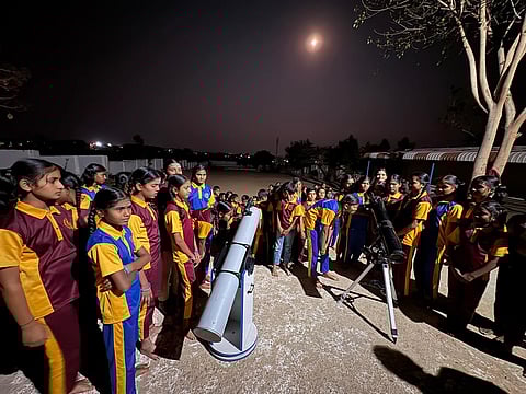 Students of School Chandana, Gadag, observe red moon